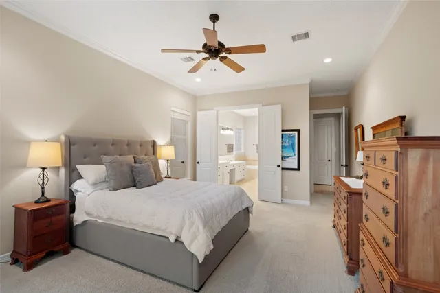 a bed room with a bed and a chandelier