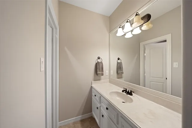 a bathroom with a double vanity sink a mirror and a shower