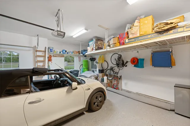a view of swimming pool with outdoor seating and plants