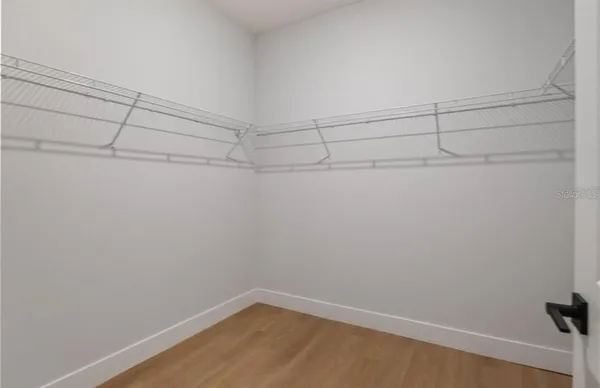 a view of a room with racks on the wall