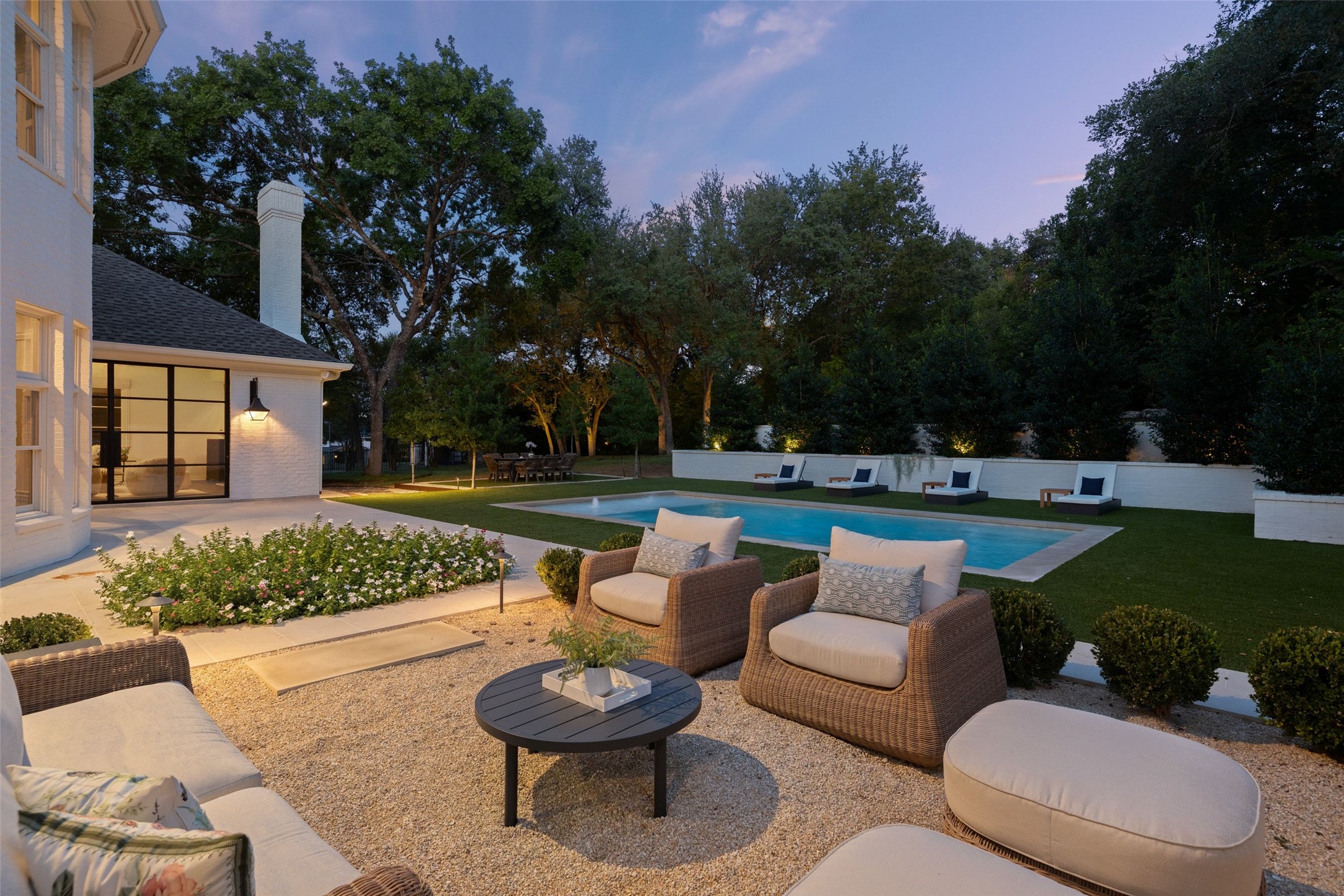 4201 Green Cliffs Road Austin, TX 78746 - Photo 34 of 40 An outdoor lounge area anchored by pavers and comfortable seating offers a comfortable spot to unwind at sunset