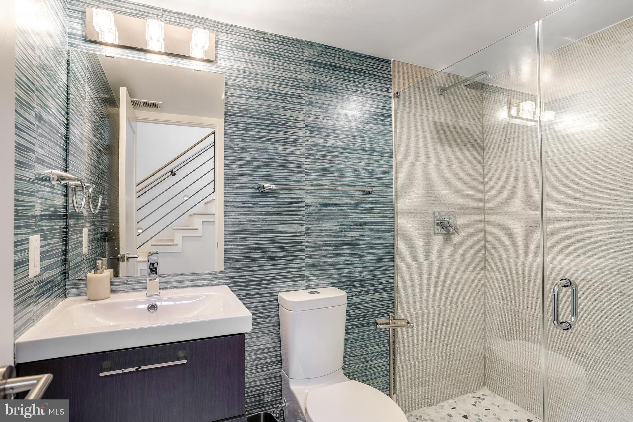 2927 Arizona Avenue Northwest Washington, DC 20016 - Photo 12 of 18 a bathroom with a sink toilet and shower