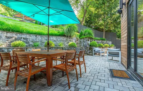 an outdoor space with furniture and umbrella