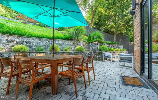 an outdoor space with furniture and umbrella