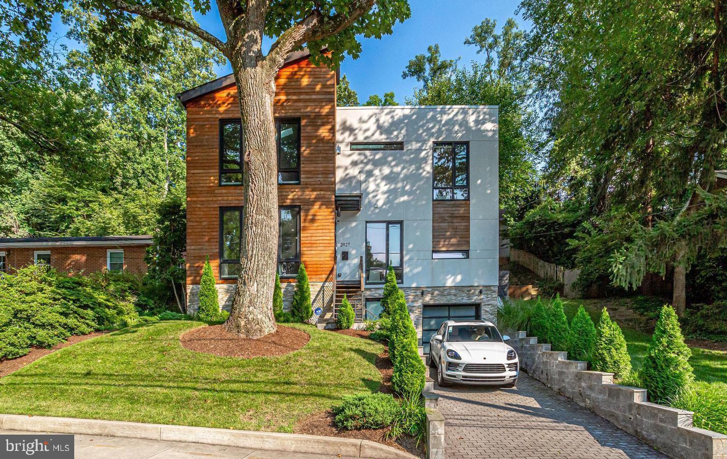 2927 Arizona Avenue Northwest Washington, DC 20016 - Photo 2 of 18 front view of house with a yard