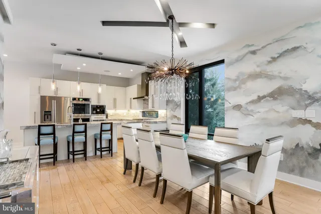 a kitchen with a table and chairs in it