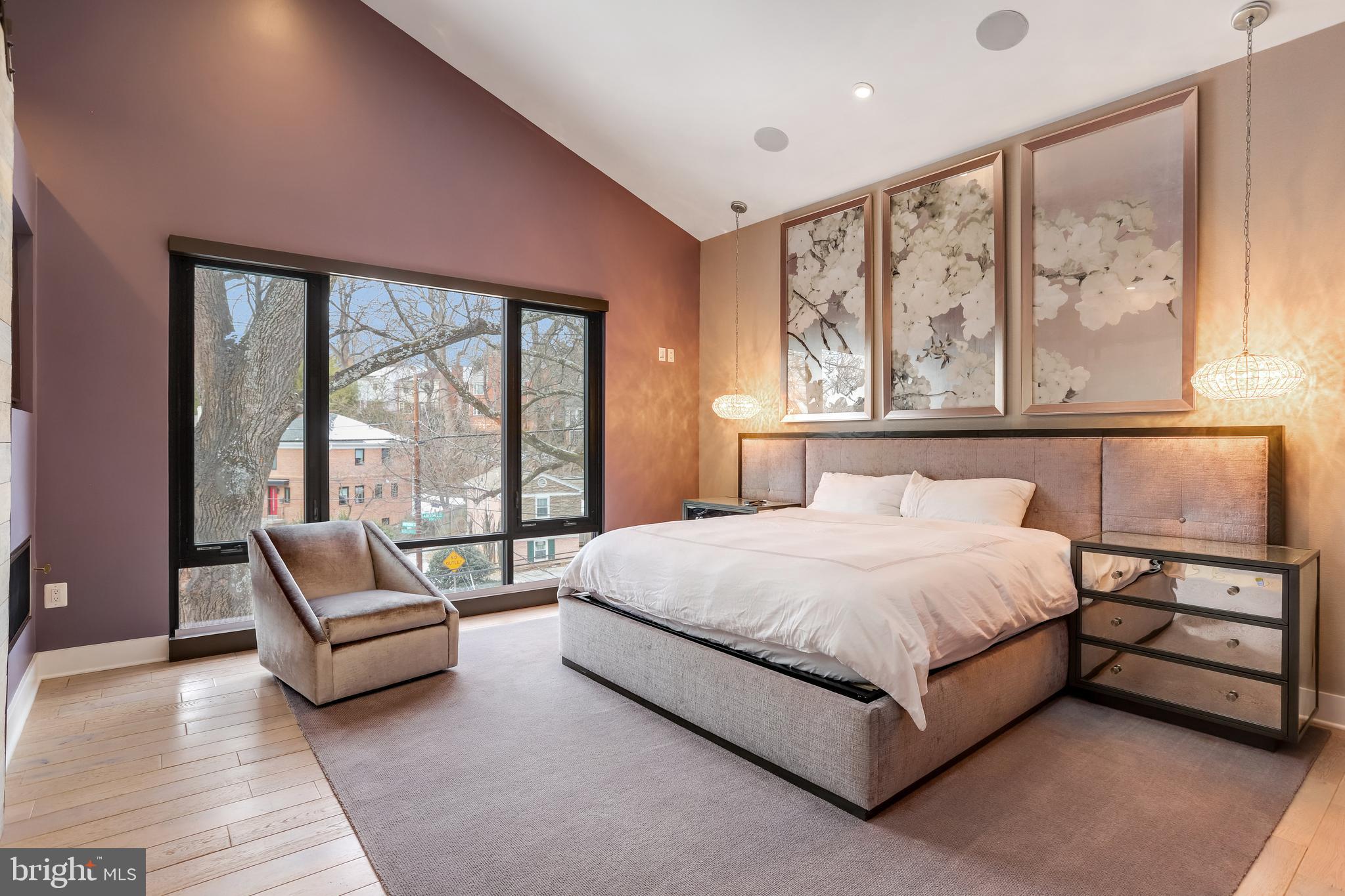 2927 Arizona Avenue Northwest Washington, DC 20016 - Photo 8 of 18 a bedroom with a bed and glass window
