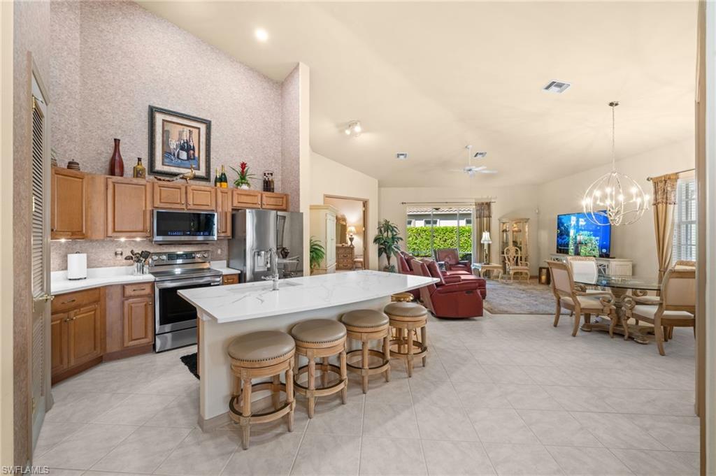 15214 Cape Sable Lane Fort Myers, FL 33908 - Photo 11 of 50 a large kitchen with a table and chairs