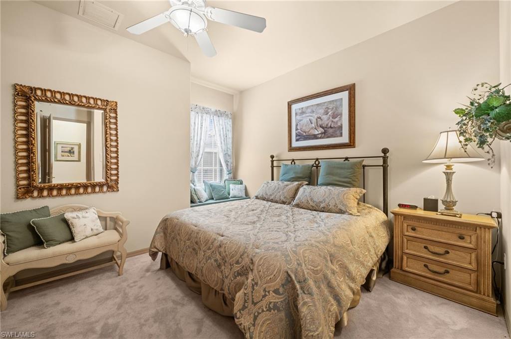 15214 Cape Sable Lane Fort Myers, FL 33908 - Photo 26 of 50 a bedroom with a bed and a couch