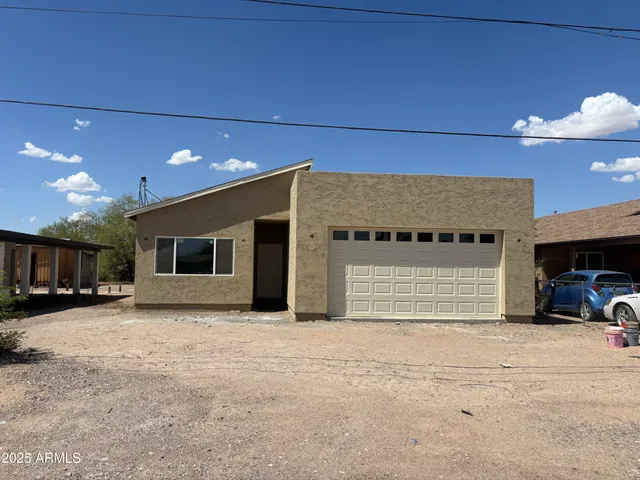 a view of a livingroom with a car parked in garage