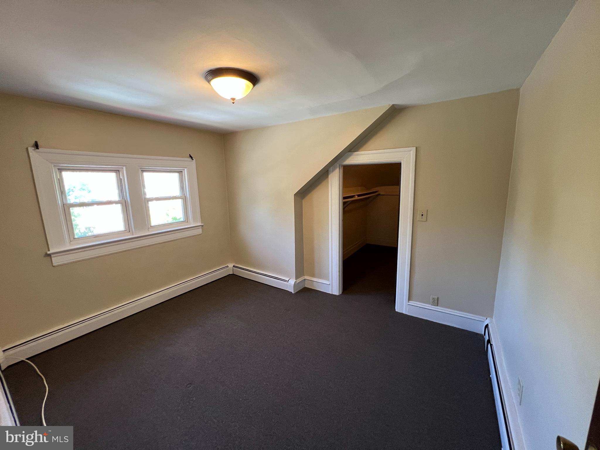 1050 Stuyvesant Avenue Trenton, NJ 08618 - Photo 7 of 11 a view of a livingroom with an empty space and window