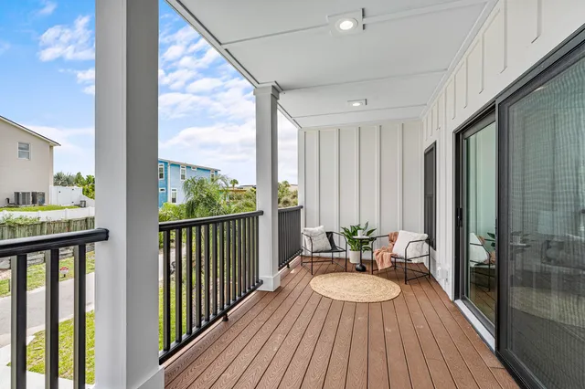 a view of balcony with wooden floor