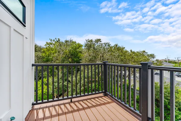 a view of staircase with wooden floor and a potted plant