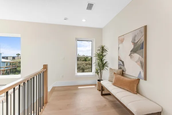 a bathroom with a granite countertop toilet sink and mirror