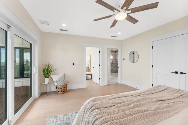 a spacious bathroom with a bathtub and toilet