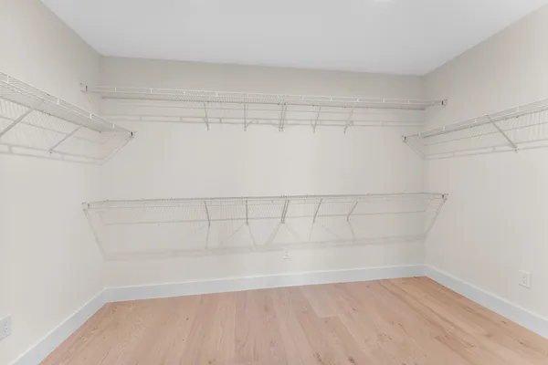 a view of a balcony with wooden floor