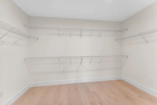 a view of a balcony with wooden floor