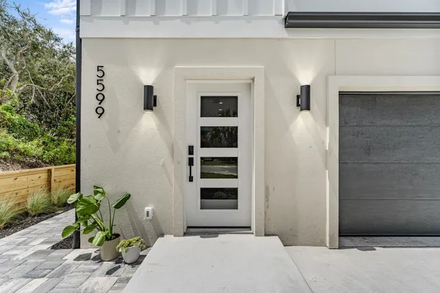 a front view of a house with outdoor space