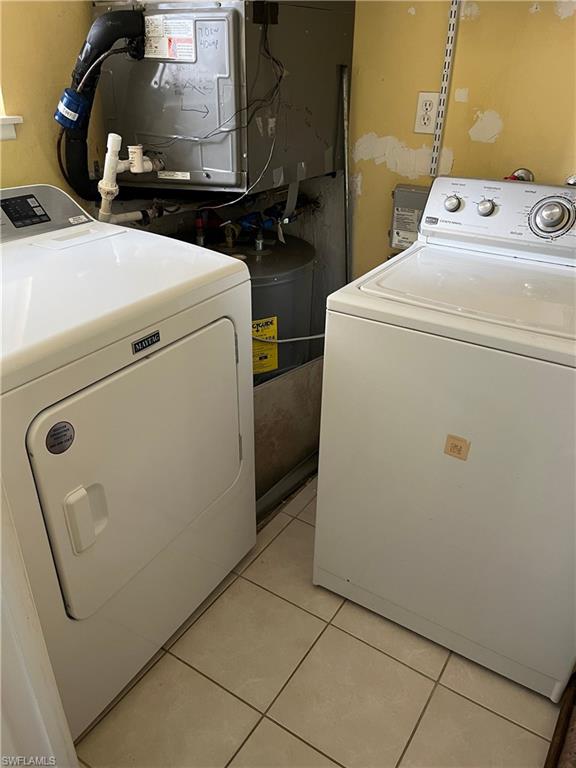 240 Palm River Boulevard, Unit C102 Naples, FL 34110 - Photo 17 of 17 a utility room with dryer and washer
