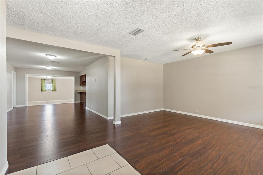 130 Audubon Road Winter Haven, FL 33884 - Photo 12 of 46 wooden floor in an empty room with a window