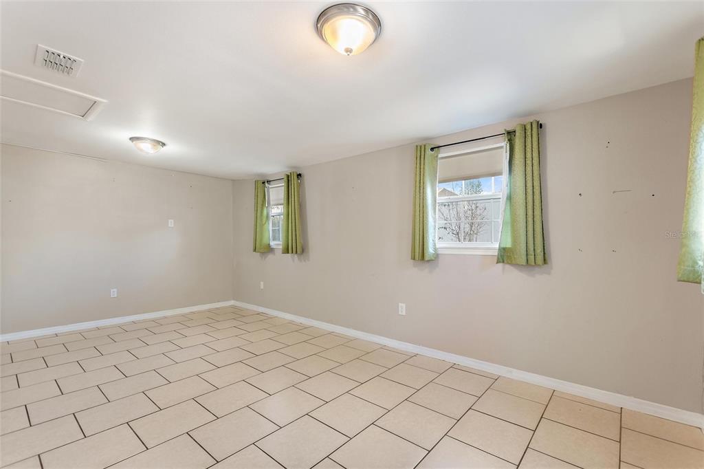 130 Audubon Road Winter Haven, FL 33884 - Photo 17 of 46 an empty room with windows