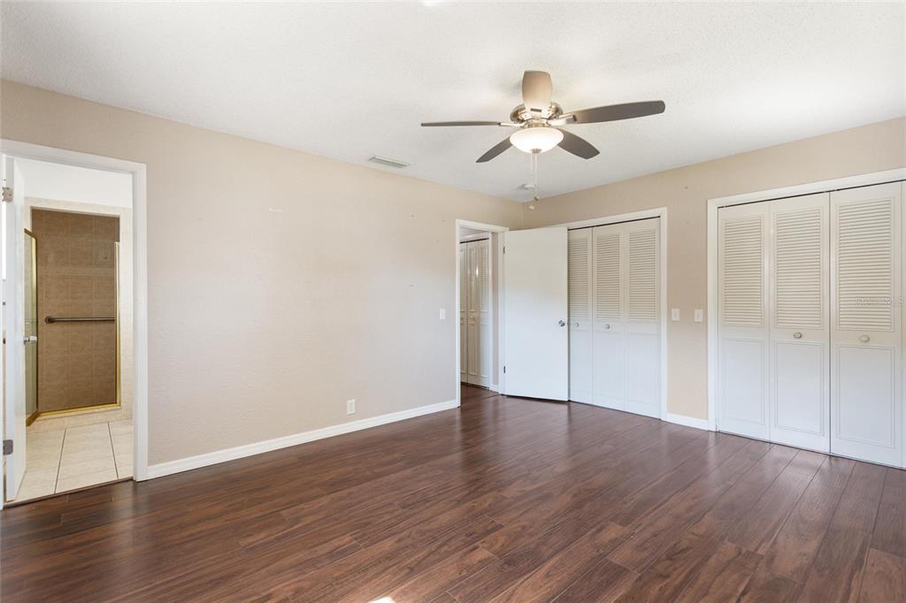 130 Audubon Road Winter Haven, FL 33884 - Photo 20 of 46 an empty room with wooden floor fan and windows