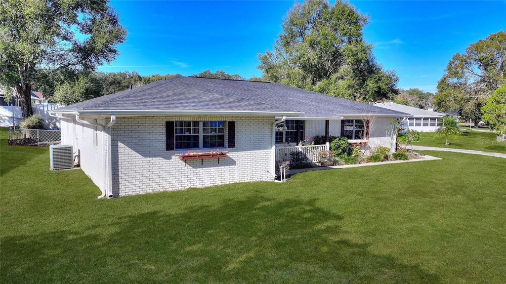 130 Audubon Road Winter Haven, FL 33884 - Photo 2 of 46 a front view of house with yard and green space
