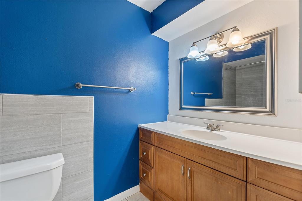 130 Audubon Road Winter Haven, FL 33884 - Photo 21 of 46 a bathroom with a sink a toilet and a mirror