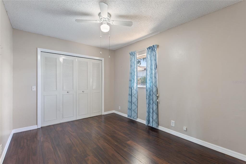 130 Audubon Road Winter Haven, FL 33884 - Photo 23 of 46 a view of an empty room with wooden floor