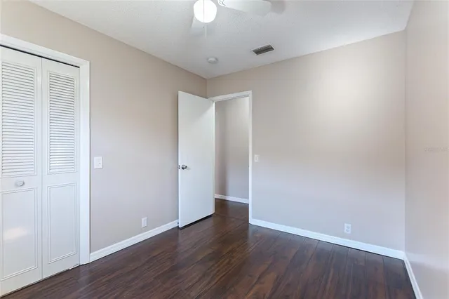 an empty room with wooden floor