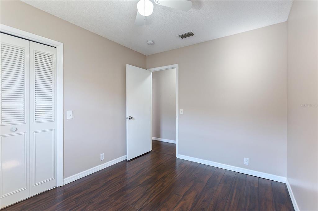 130 Audubon Road Winter Haven, FL 33884 - Photo 25 of 46 an empty room with wooden floor