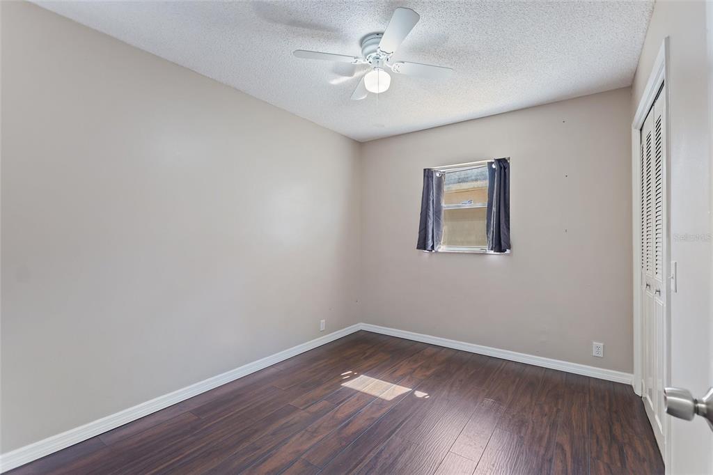 130 Audubon Road Winter Haven, FL 33884 - Photo 26 of 46 wooden floor in an empty room with a window