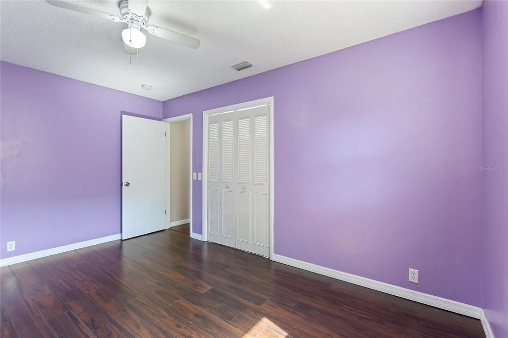 130 Audubon Road Winter Haven, FL 33884 - Photo 28 of 46 a view of an empty room with wooden floor