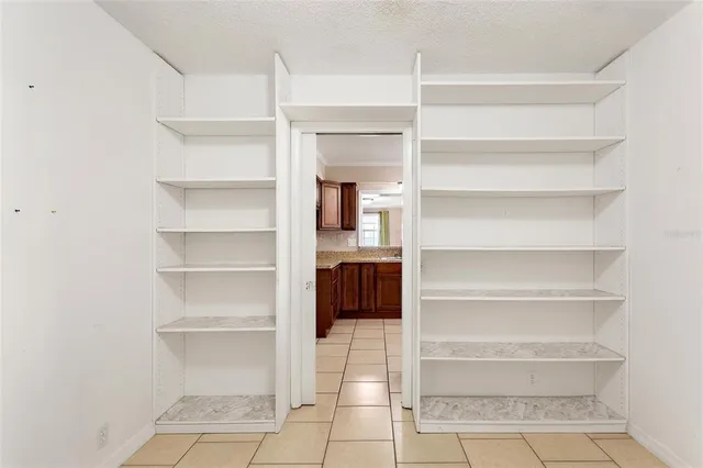 a view of a room with a cabinets and a fireplace