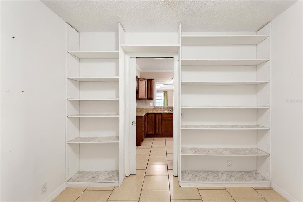 130 Audubon Road Winter Haven, FL 33884 - Photo 30 of 46 a view of a room with a cabinets and a fireplace