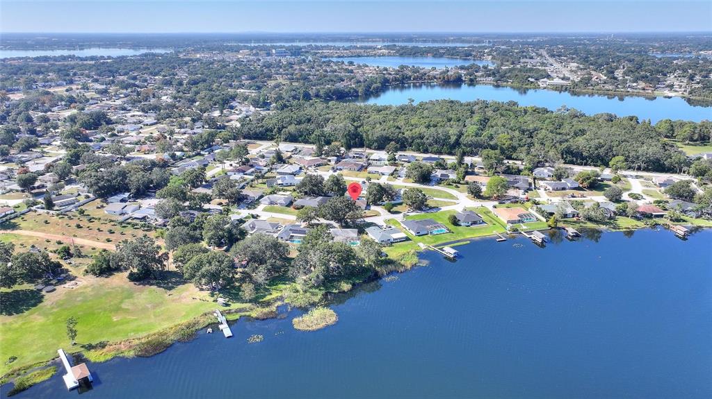 130 Audubon Road Winter Haven, FL 33884 - Photo 40 of 46 an aerial view of a houses with a swimming pool
