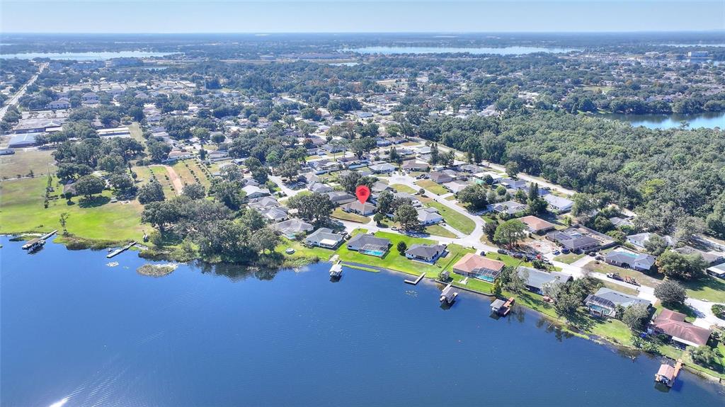 130 Audubon Road Winter Haven, FL 33884 - Photo 44 of 46 an aerial view of a houses with a yard and lake view