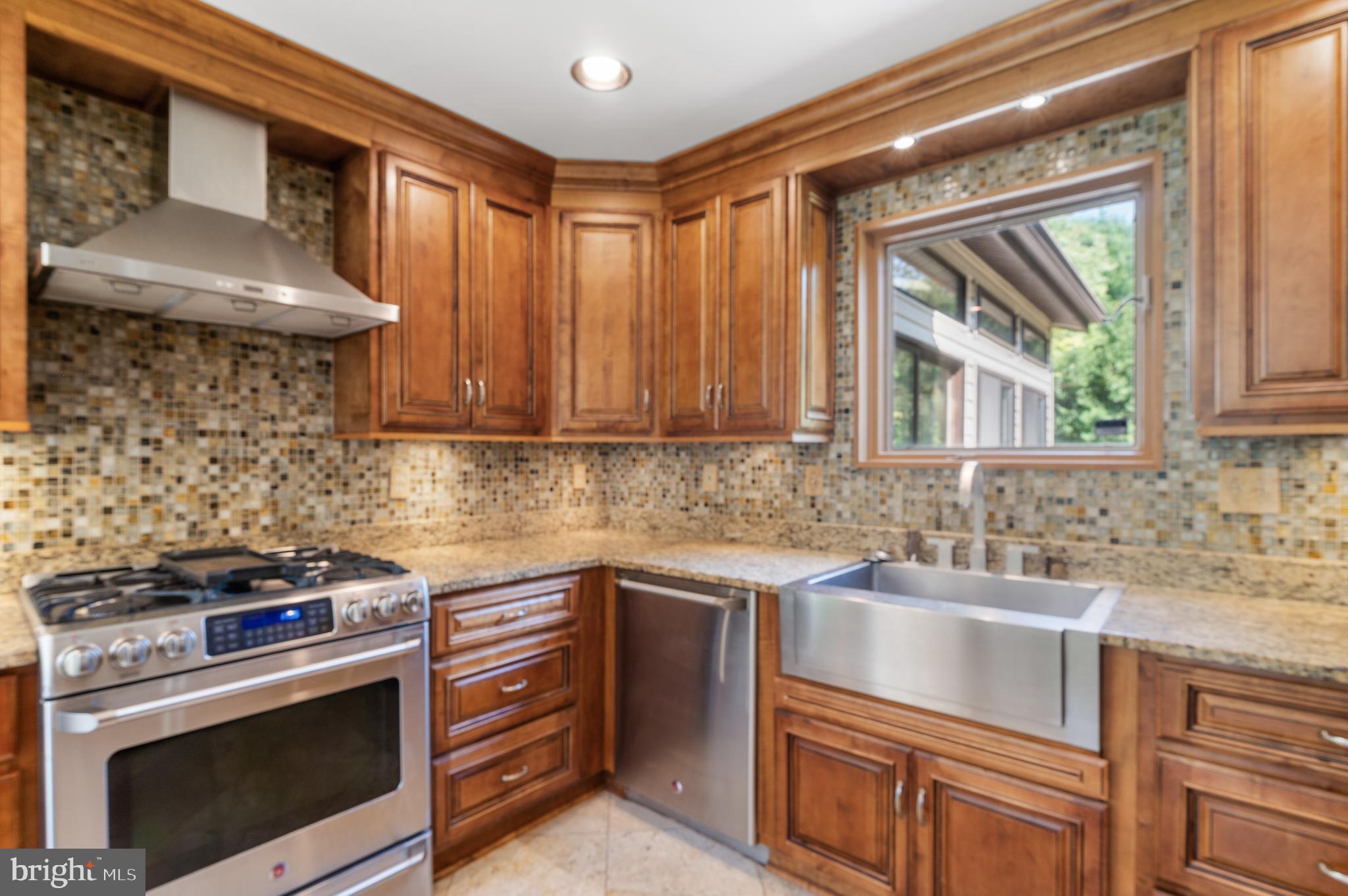 15729 Holly Grove Road Silver Spring, MD 20905 - Photo 11 of 83 Elegant kitchen with rich wood cabinetry.