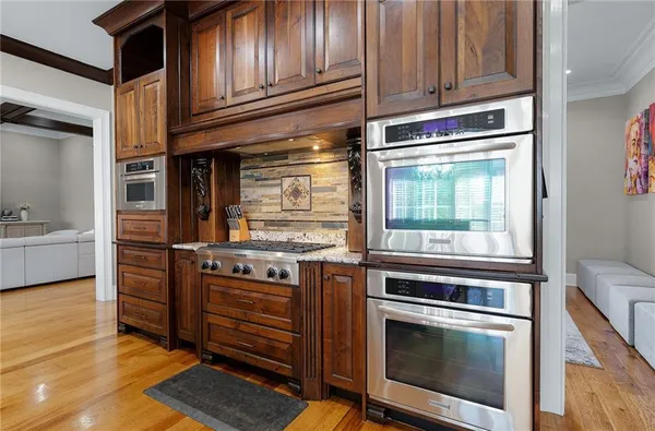a utility room with granite countertop a sink and a washer dryer