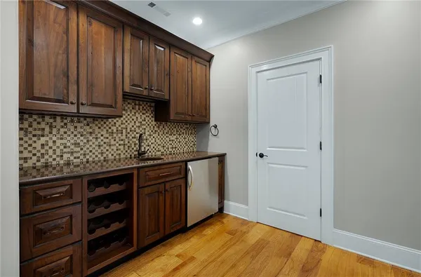 a spacious bathroom with a sink a large mirror and a shower