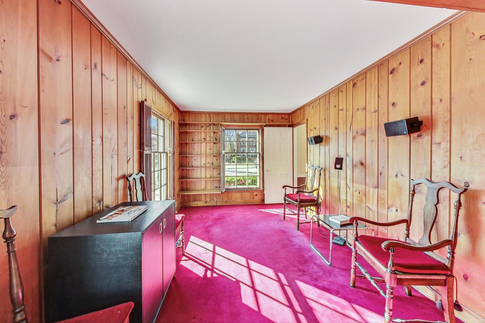 765 Walden Road Winnetka, IL 60093 - Photo 14 of 40 a spacious bedroom with a bed a table and chair