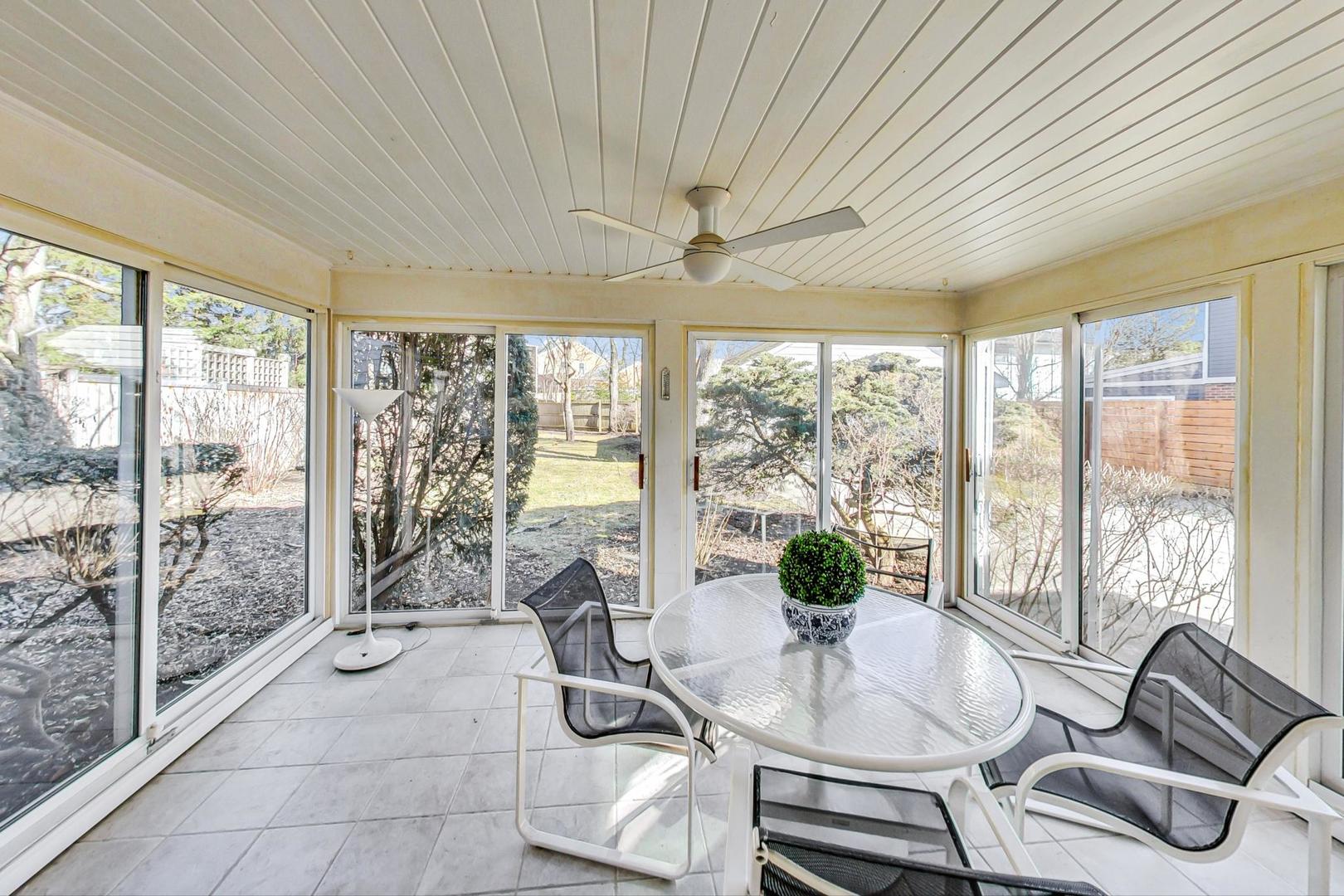 765 Walden Road Winnetka, IL 60093 - Photo 15 of 40 a living room with furniture and a large window