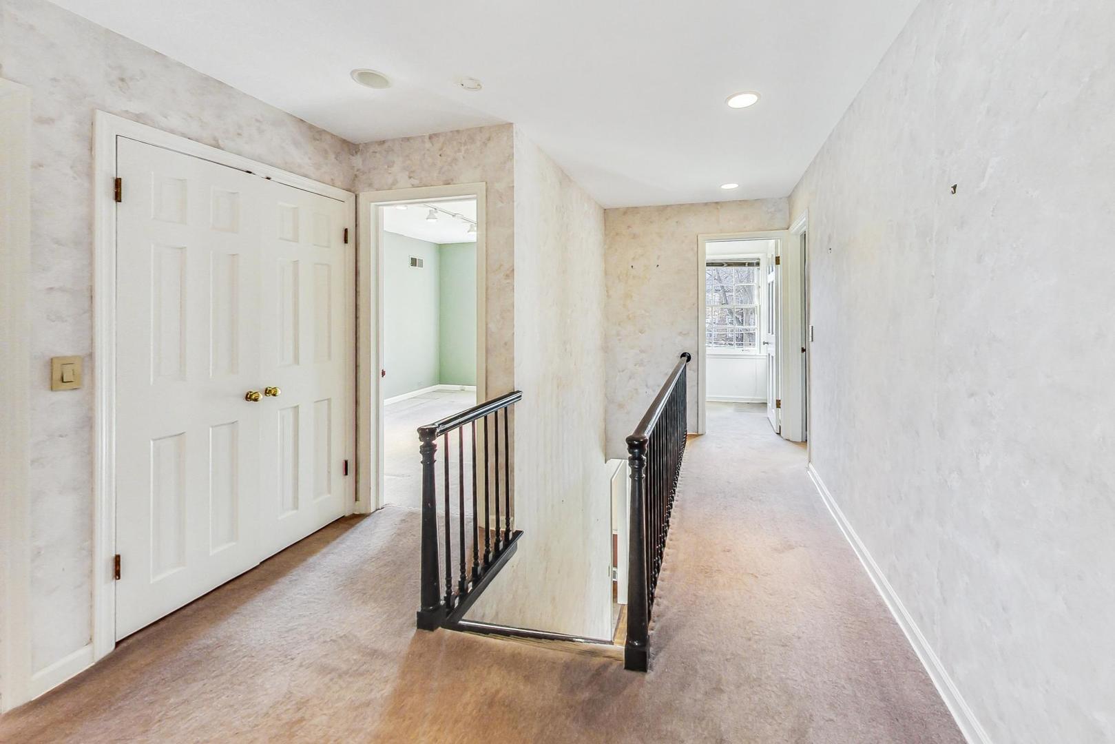765 Walden Road Winnetka, IL 60093 - Photo 17 of 40 a view of a hallway with wooden floor and entryway