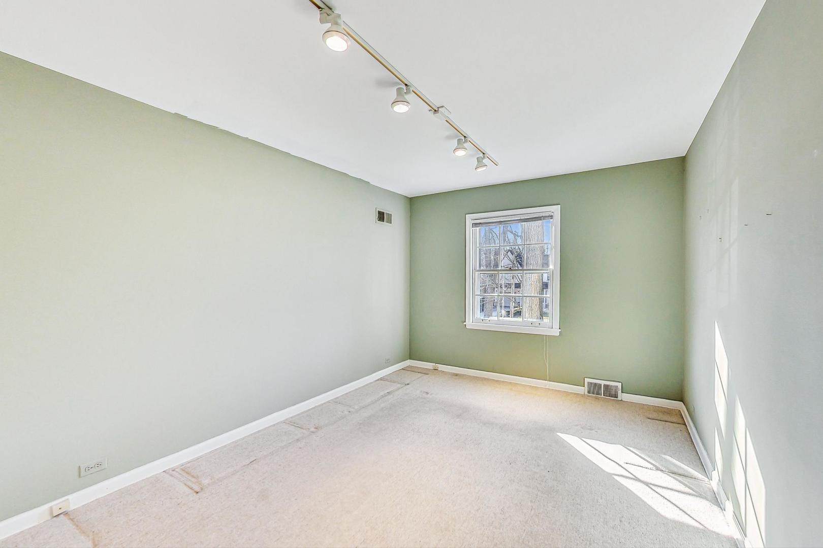 765 Walden Road Winnetka, IL 60093 - Photo 21 of 40 a view of a big room with window and cabinet