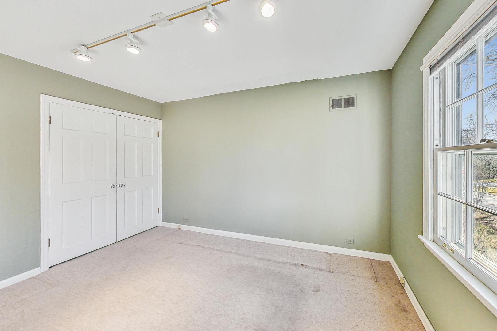765 Walden Road Winnetka, IL 60093 - Photo 22 of 40 an empty room with windows