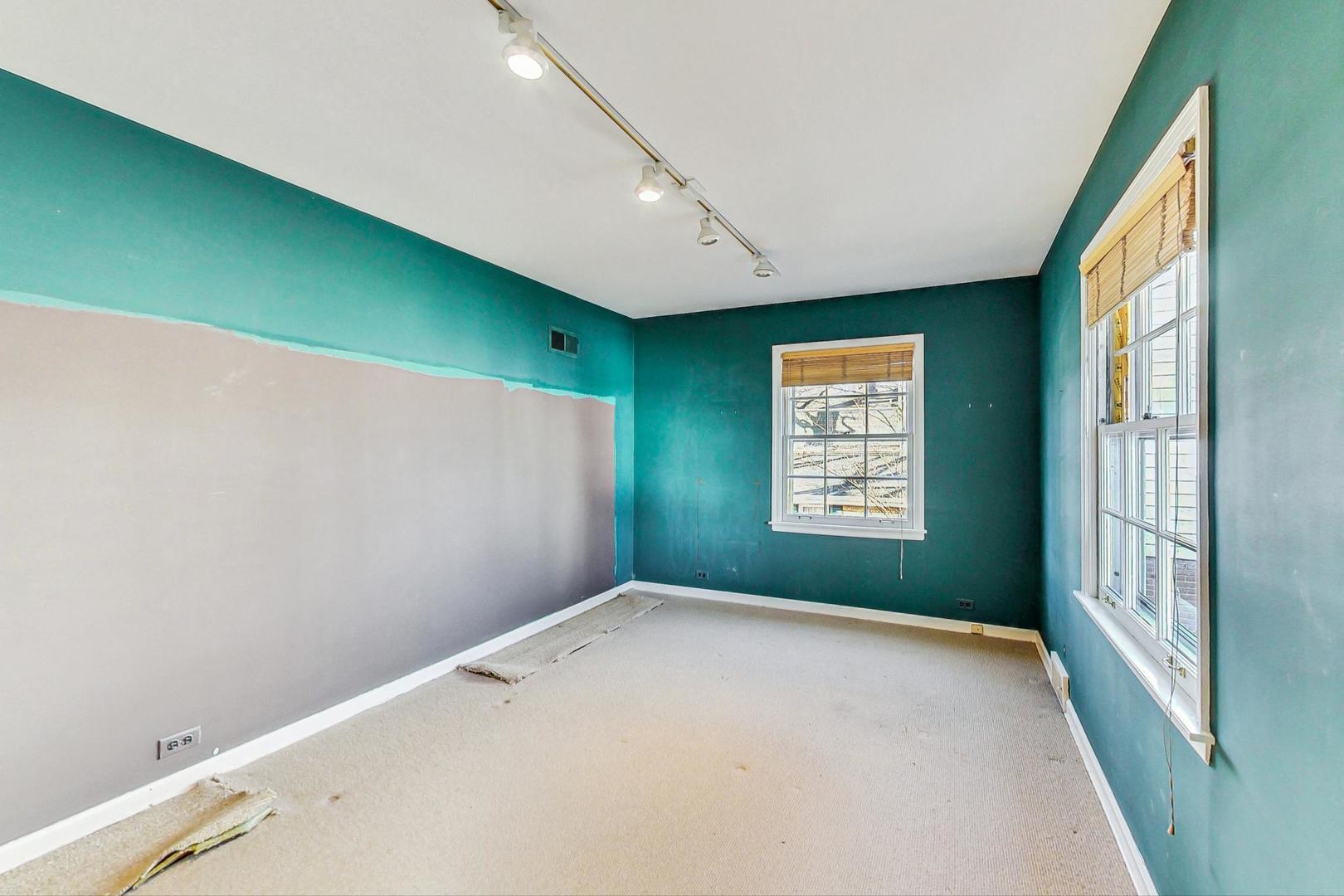 765 Walden Road Winnetka, IL 60093 - Photo 24 of 40 a view of a big room with windows and chandelier