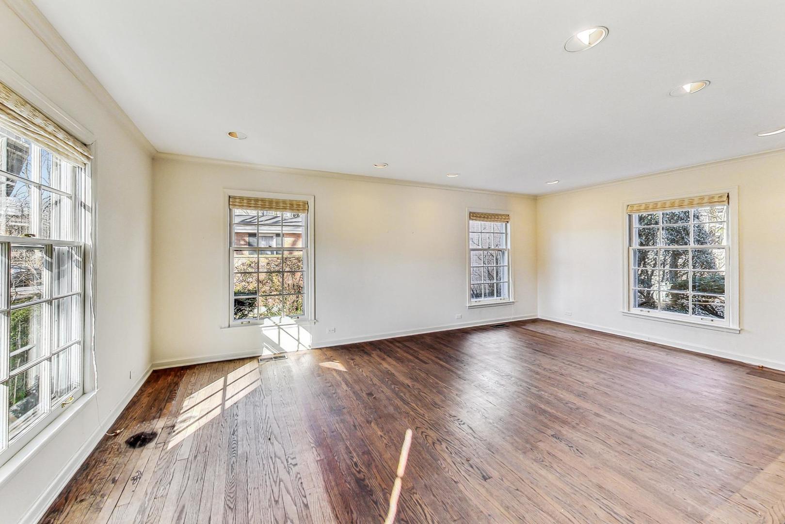 765 Walden Road Winnetka, IL 60093 - Photo 4 of 40 an empty room with wooden floor and windows