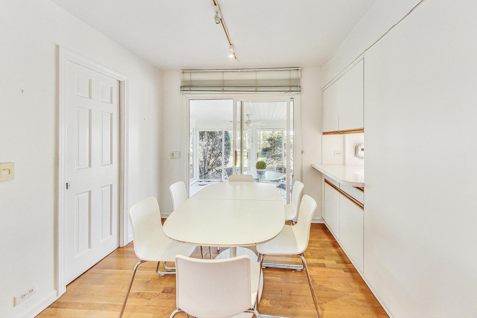 765 Walden Road Winnetka, IL 60093 - Photo 10 of 40 a dining room with table and chairs