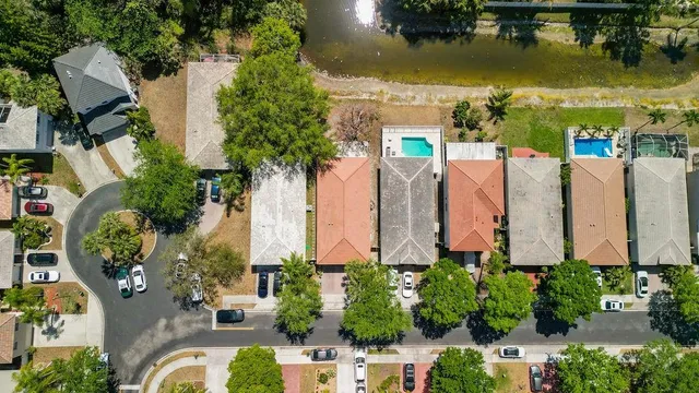 an aerial view of residential house with outdoor space and swimming pool