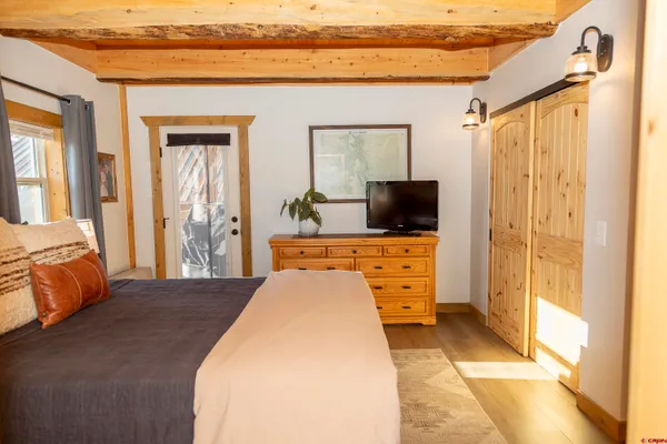 a room with a bench and wooden floor